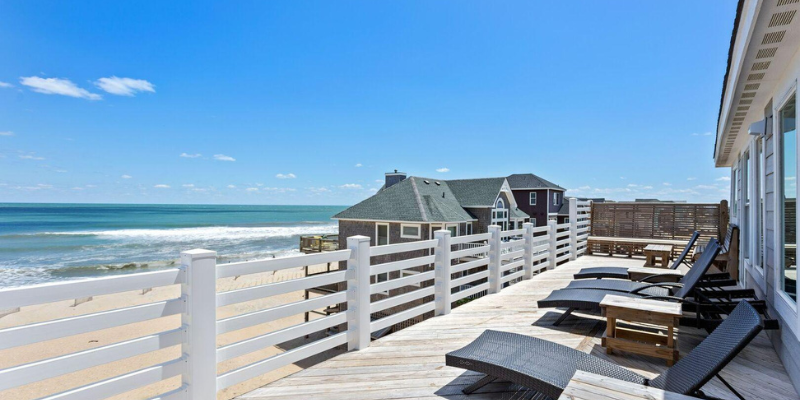 Find a home with a view - like Groovin'! Top sun deck of beach house overlooking the ocean.